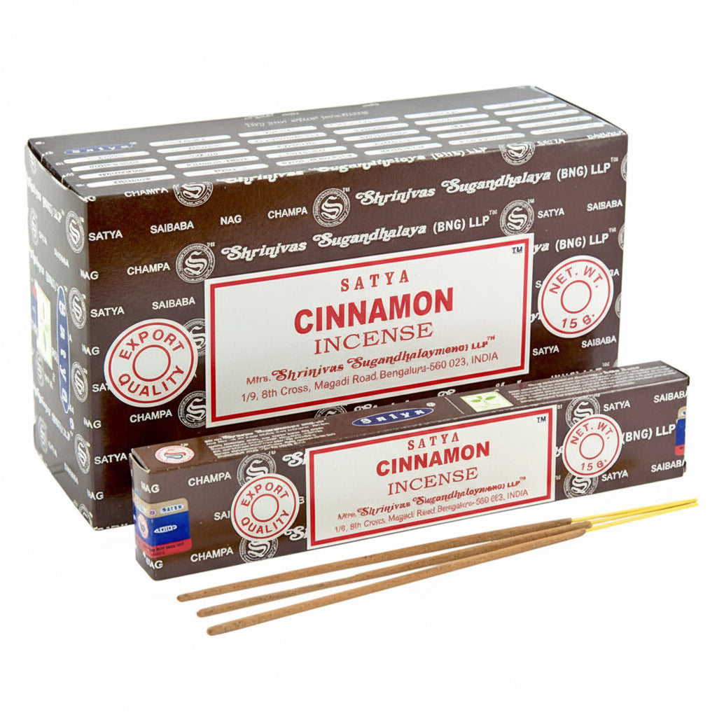 Satya Cinnamon incense packaging with sticks on a white background